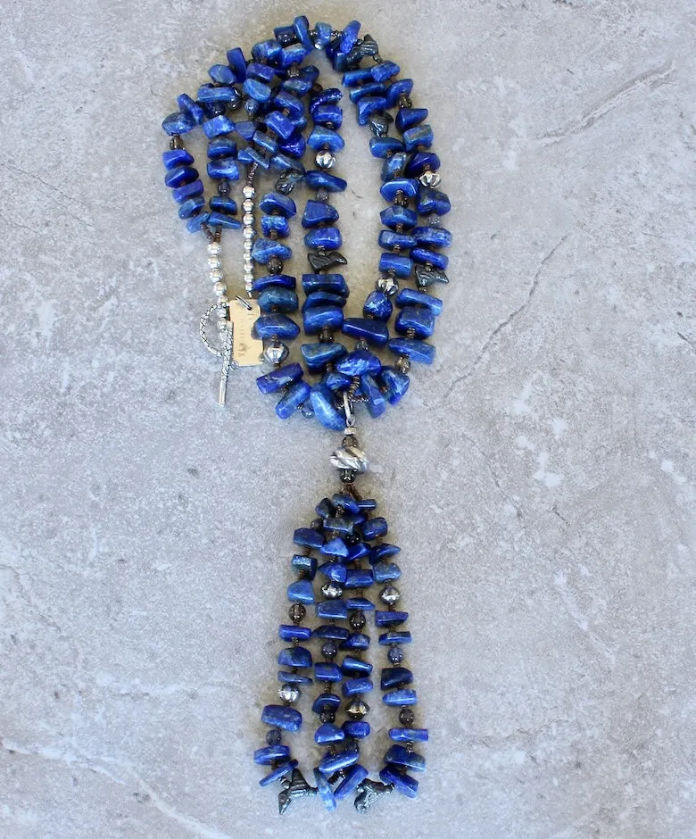 Lapis Lazuli Graduated Nugget 2-Strand Necklace with 2-Loop Lapis Jacla, Black Clay Bird Amulets, Blue Iolite and Smoky Quartz Rounds, Olive Shell Heishi, and Sterling Silver Rounds, Fluted Bicones, Coiled Rondelle Bead & Toggle Clasp