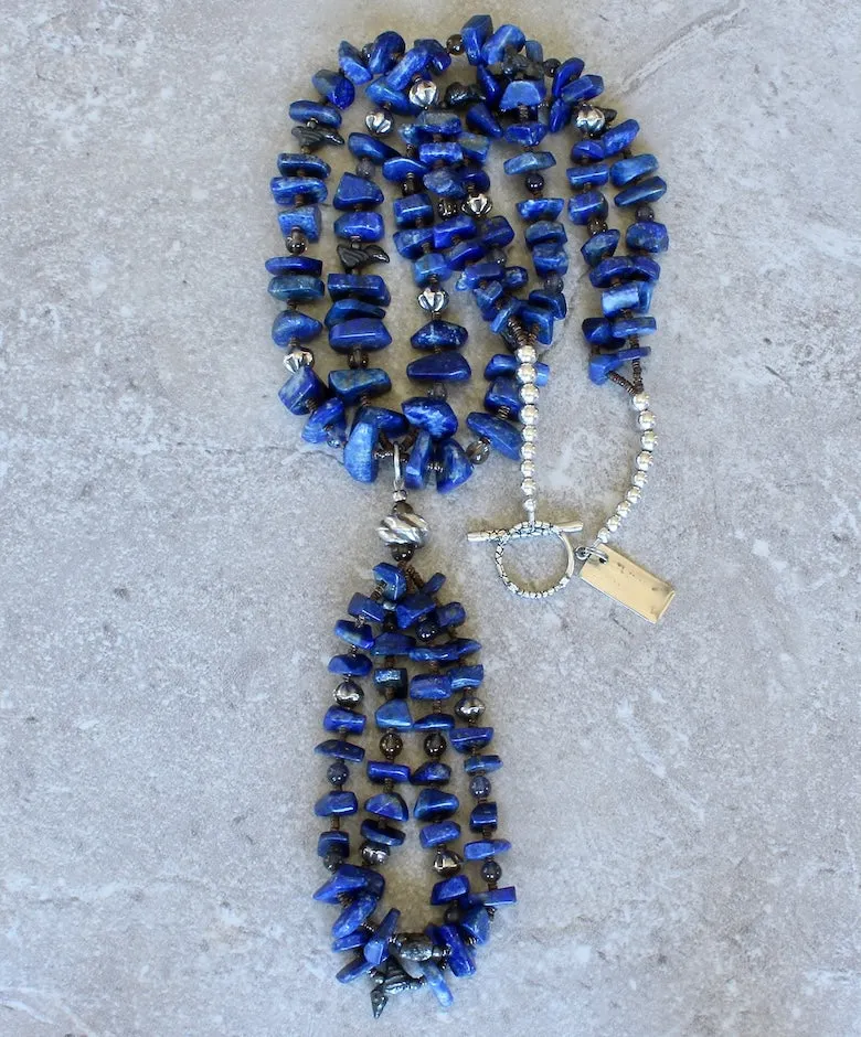 Lapis Lazuli Graduated Nugget 2-Strand Necklace with 2-Loop Lapis Jacla, Black Clay Bird Amulets, Blue Iolite and Smoky Quartz Rounds, Olive Shell Heishi, and Sterling Silver Rounds, Fluted Bicones, Coiled Rondelle Bead & Toggle Clasp